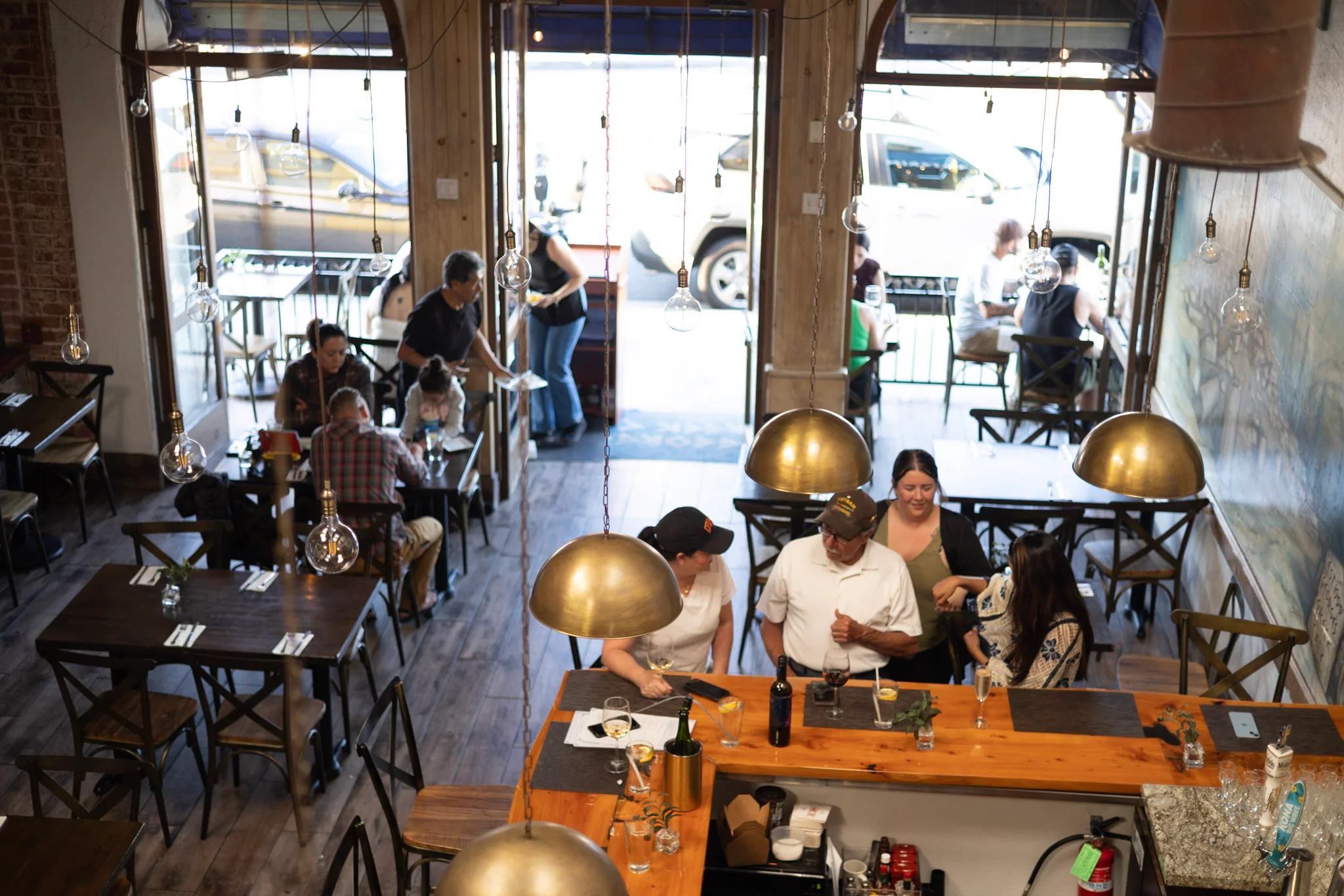 Guests gathered around tables inside George’s Greek Cafe