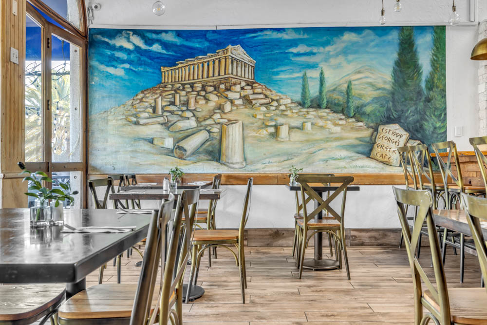 Seating beside the Greek mural at George’s
